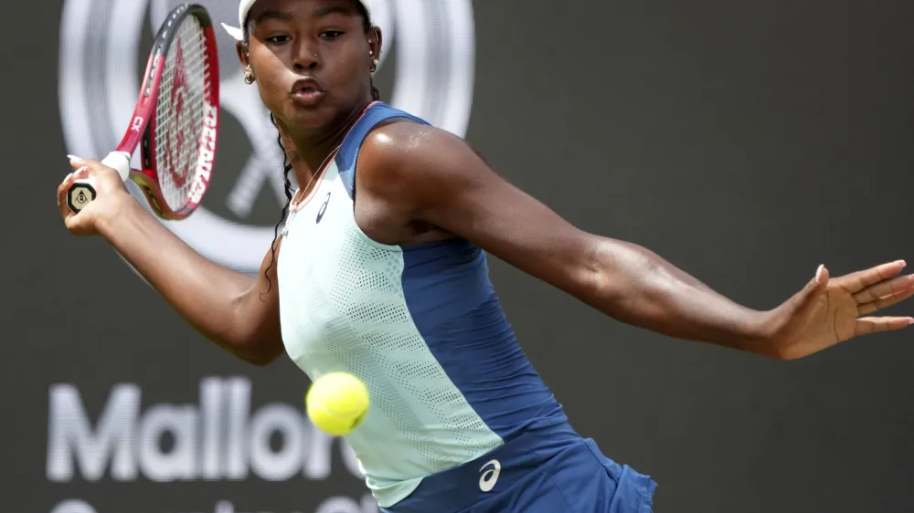 FILE - Alycia Parks from the United States returns the ball to Ons Jabeur from Tunisia during their WTA tournament round of 16 tennis match in Berlin, Germany, June 16, 2022. On Sunday, Feb. 5, 2023, Parks secured a stunning 7-6 (7), 7-5 upset win over WTA Finals champion Caroline Garcia in the Open M&eacute;tropole de Lyon final to clinch her first career title. (AP Photo/Michael Sohn, File)