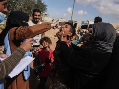07 March 2023, Syria, Sarmada: A child receives a cholera vaccine at a camp in the city of Sarmada. The Syria Immunization Team started a cholera vaccination campaign that targeted camps and schools due to the spread of cholera in northwest Syria. Photo: Anas Alkharboutli/dpa