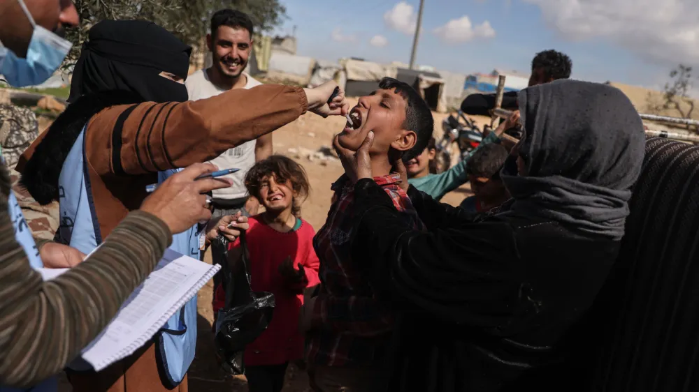 07 March 2023, Syria, Sarmada: A child receives a cholera vaccine at a camp in the city of Sarmada. The Syria Immunization Team started a cholera vaccination campaign that targeted camps and schools due to the spread of cholera in northwest Syria. Photo: Anas Alkharboutli/dpa