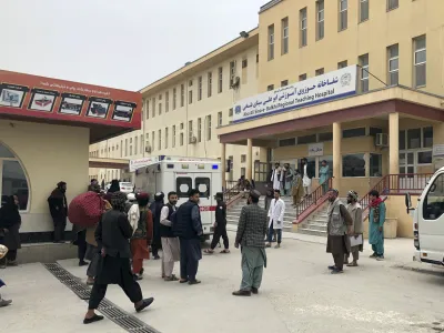 People stand outside a hospital after a bomb blast in Mazar-e Sharif, the capital city of Balkh province, in northern Afghanistan, Thursday, Mar. 9, 2023. A bomb killed a Taliban-appointed provincial governor and two others in Afghanistan's Mazar-e- Sharif Thursday, a Taliban police spokesman said. (AP Photo/Abdul Saboor Sirat)