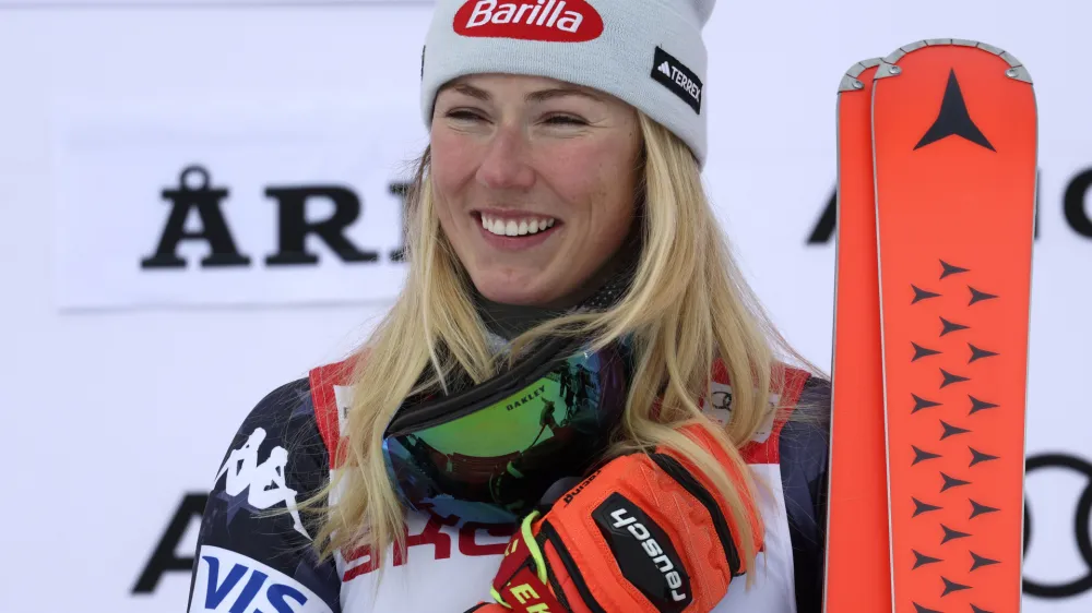 FILE - United States' Mikaela Shiffrin celebrates on the podium after winning an alpine ski, women's World Cup giant slalom race, in Are, Sweden, Friday, March 10, 2023. Fresh off breaking the record for most World Cup race wins, Mikaela Shiffrin has a new head coach, Karin Harjo, who has been leading Canada's Alpine skiing team. U.S. Ski & Snowboard announced Harjo's hiring on Monday, March 13, 2023, and said she will join Shiffrin in April. (AP Photo/Alessandro Trovati, File)