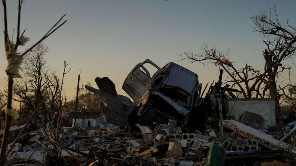 A vehicle sits on top of a pile of rubble after thunderstorms spawning high straight-line winds and tornadoes ripped across the state in Rolling Fork, Mississippi, U.S., March 25, 2023. REUTERS/Cheney Orr