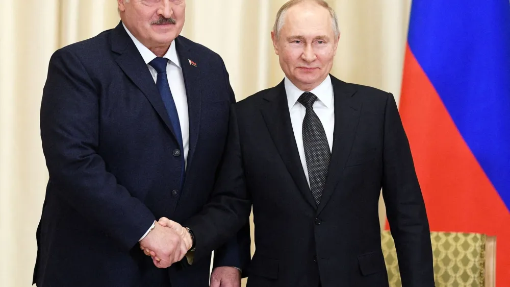 FILE PHOTO: Russian President Vladimir Putin shakes hands with Belarusian President Alexander Lukashenko during a meeting at the Novo-Ogaryovo state residence outside Moscow, Russia February 17, 2023. Sputnik/Vladimir Astapkovich/Kremlin via REUTERS ATTENTION EDITORS - THIS IMAGE WAS PROVIDED BY A THIRD PARTY./File Photo