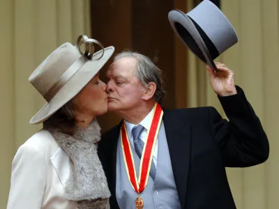 Britain's favourite television actor Sir David Jason and his wife Gill, pose outside Buckingham Palace in London, Thursday Dec. 1, 2005, after receiving his knighthood from Queen Elizabeth II during an investiture ceremony. The couple, who have a daughter, Sophie Mae, aged 4, were married in a secret ceremony in front of 12 guests in London's Dorchester Hotel on Nov. 30.(AP Photo/Fiona Hanson, pool)