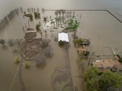 FILE - A home sits in rising floodwaters after a levee break caused extensive flooding around Corcoran, Calif., on Tuesday, March 21, 2023. (Carlos Avila Gonzalez/San Francisco Chronicle via AP, File)
