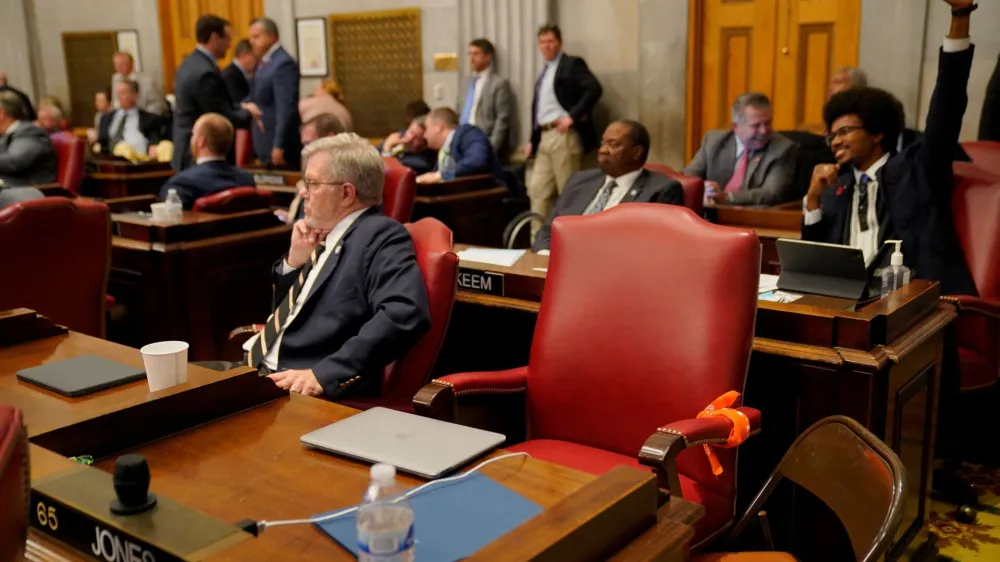 Rep. Justin Jones chair is seen empty and wrapped with a protest bandana ahead of a vote at the Tennessee House of Representatives to expel him for his role in a gun control demonstration at the statehouse last week, in Nashville, Tennessee, U.S., April 6, 2023. REUTERS/Cheney Orr