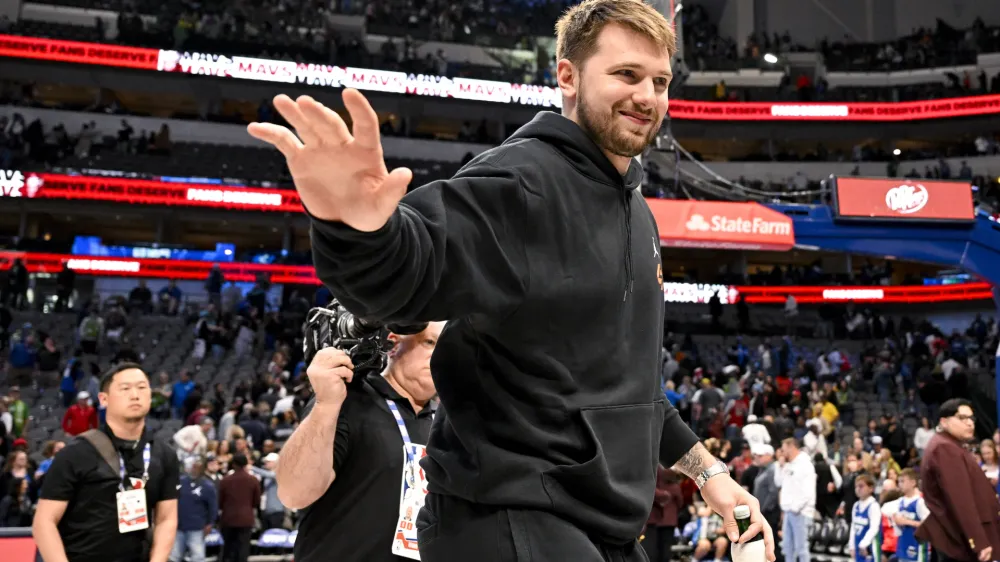 Apr 7, 2023; Dallas, Texas, USA; Dallas Mavericks guard Luka Doncic (77) waves to the crowd as he walks off the court after the Mavericks loss to the Chicago Bulls at the American Airlines Center. Mandatory Credit: Jerome Miron-USA TODAY Sports