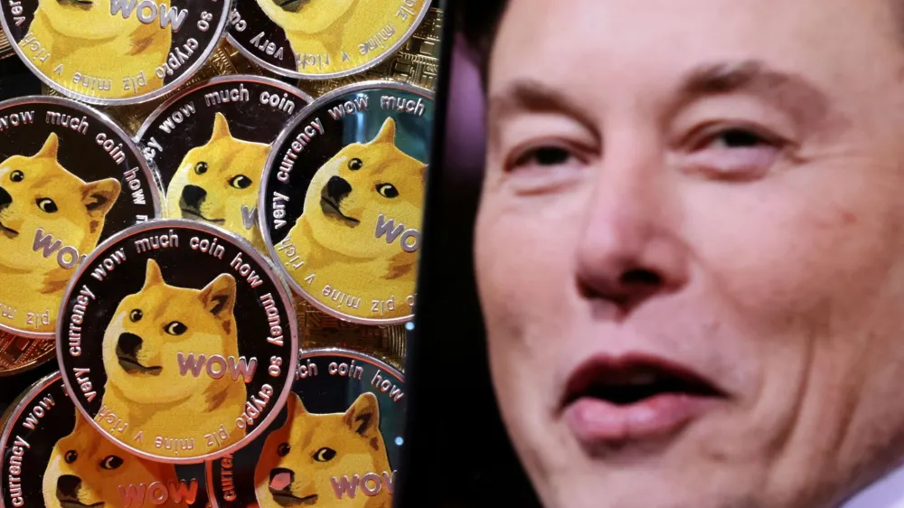 A photo of Elon Musk is displayed on a smartphone placed on representations of cryptocurrency Dogecoin in this illustration taken June 16, 2022. REUTERS/Dado Ruvic/Illustration