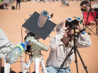 People watch a total solar eclipse at a viewing site 35km from Exmouth, Western Australia, April 20, 2023. AAP Image/Aaron Bunch via REUTERS ATTENTION EDITORS - THIS IMAGE WAS PROVIDED BY A THIRD PARTY. NO RESALES. NO ARCHIVE. AUSTRALIA OUT. NEW ZEALAND OUT