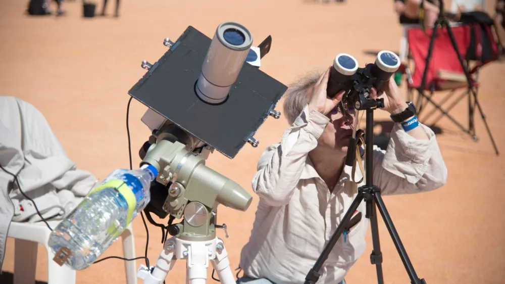 People watch a total solar eclipse at a viewing site 35km from Exmouth, Western Australia, April 20, 2023. AAP Image/Aaron Bunch via REUTERS ATTENTION EDITORS - THIS IMAGE WAS PROVIDED BY A THIRD PARTY. NO RESALES. NO ARCHIVE. AUSTRALIA OUT. NEW ZEALAND OUT