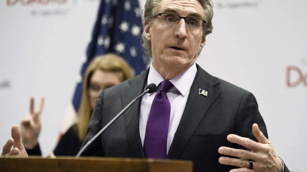 FILE - North Dakota Gov. Doug Burgum speaks at the state Capitol on April 10, 2020, in Bismarck, N.D. Burgum signed an abortion ban at six weeks of pregnancy &mdash; even in cases of rape or incest &mdash; into law on Monday, April 24, 2023. (Mike McCleary/The Bismarck Tribune via AP, File)