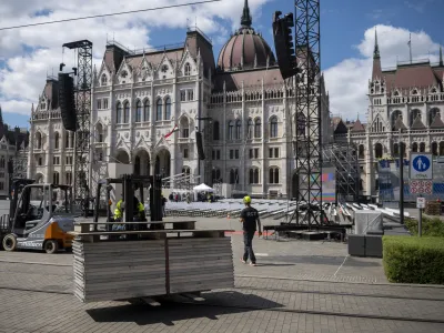 Preparations at Kossuth Lajos' Square where Pope Francis will lead a Holy Mass, in Budapest Thursday, April 27, 2023 during his visit to Hungary. Members of the Catholic community expect the pope's visit to be a celebration of Christian unity, and that a divergence of perspectives will not play a central role in Francis' visit to Hungary. (AP Photo/Denes Erdos)