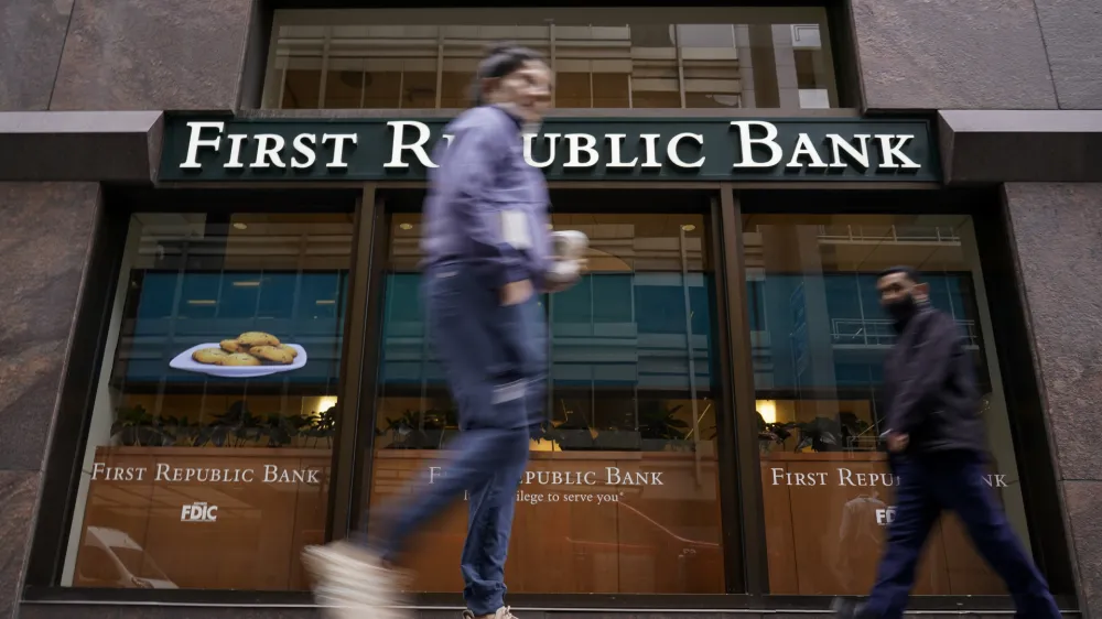 Pedestrians walk past the headquarters of First Republic Bank in San Francisco, Monday, May 1, 2023. The Fed's interest rate decision, announced on Wednesday, comes against the backdrop of both still-high inflation and the persistent turmoil in the banking industry. (AP Photo/Godofredo A. V&aacute;squez)
