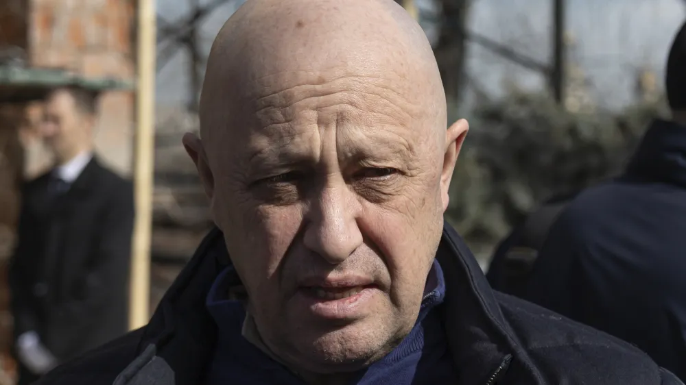 FILE - Yevgeny Prigozhin, the owner of the Wagner Group military company, arrives during a funeral ceremony at the Troyekurovskoye cemetery in Moscow, Russia, Saturday, April 8, 2023. Prigozhin is threatening to pull his troops out of the protracted battle for the eastern Ukraine city of Bakhmut next week. He accused Russia's military command Friday, May 5 of starving his forces of ammunition and rendering them unable to fight. (AP Photo, file)