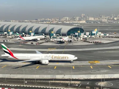 FILE PHOTO: Emirates airliners are seen on the tarmac in a general view of Dubai International Airport in Dubai, United Arab Emirates January 13, 2021. Picture taken through a window. REUTERS/Abdel Hadi Ramahi//File Photo