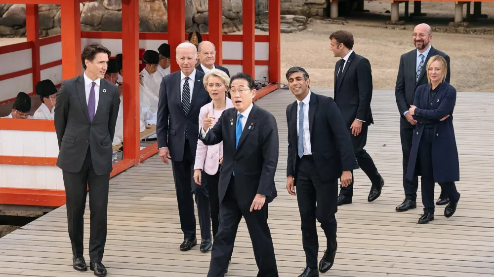 U.S. President Joe Biden, Germany's Chancellor Olaf Scholz, Britain's Prime Minister Rishi Sunak, European Commission President Ursula von der Leyen, President of the European Council Charles Michel, Italy's Prime Minister Giorgia Meloni, Canada's Prime Minister Justin Trudeau, France's President Emmanuel Macron and Japan's Prime Minister Fumio Kishida visit at Itsukushima Shrine for a family photo session during G7 leaders' summit in Hiroshima, western Japan May 19, 2023, in this photo released by Kyodo. Mandatory credit Kyodo via REUTERS ATTENTION EDITORS - THIS IMAGE WAS PROVIDED BY A THIRD PARTY. MANDATORY CREDIT. JAPAN OUT. NO COMMERCIAL OR EDITORIAL SALES IN JAPAN