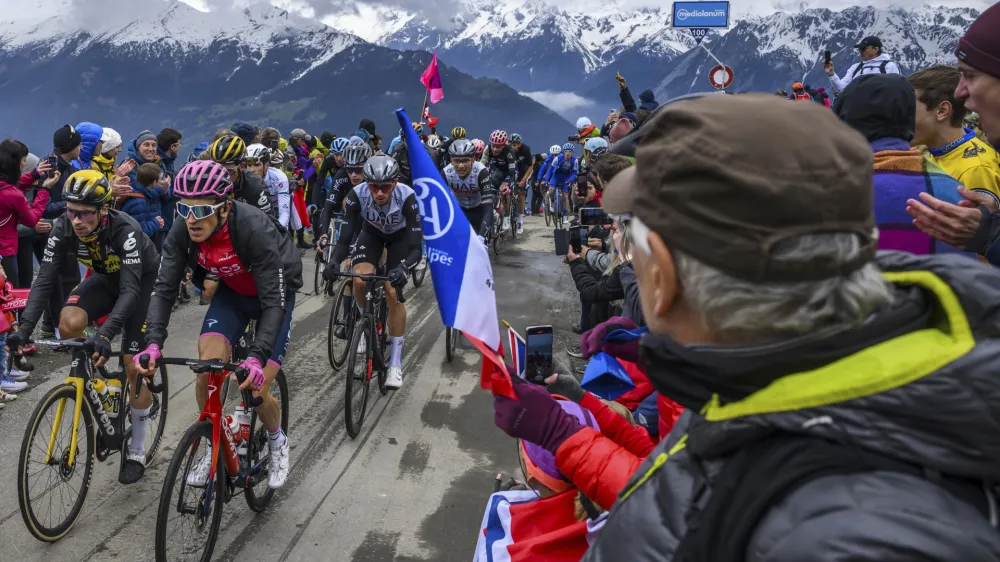 Slovenia's Primoz Roglic, left, and overall leader Britain's Geraint Thomas climb the Croix de Coeur pass, during the 13th stage of the Giro D'Italia, tour of Italy cycling race, in Verbier, Switzerland, Friday, May 19, 2023. (Jean-Christophe Bott/Keystone via AP)
