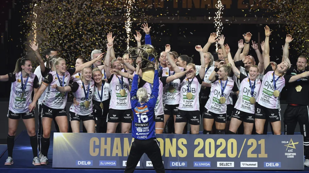 Players of Vipers Kristiansand celebrate with the trophy after they won women's handball Champions' League final match Vipers Kristiansand vs. Brest Bretagne Handball in Papp Laszlo Budapest Sports Arena in Budapest, Hungary, Sunday, May 30, 2021. (Tibor Illyes/MTI via AP)