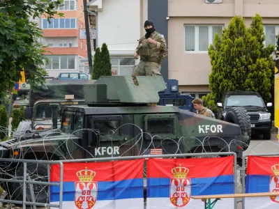 U.S. members of the NATO-led Kosovo Force (KFOR) stand guard outside municipal offices in Leposavic, Kosovo, June 2, 2023. REUTERS/Ognen Teofilovski