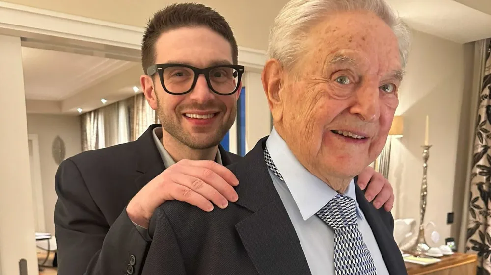 George Soros is seen with his son Alexander, in Munich, Germany in this picture obtained from social media and released February 16, 2023. Alex Soros via Twitter/via REUTERS THIS IMAGE HAS BEEN SUPPLIED BY A THIRD PARTY. MANDATORY CREDIT. NO RESALES. NO ARCHIVES.