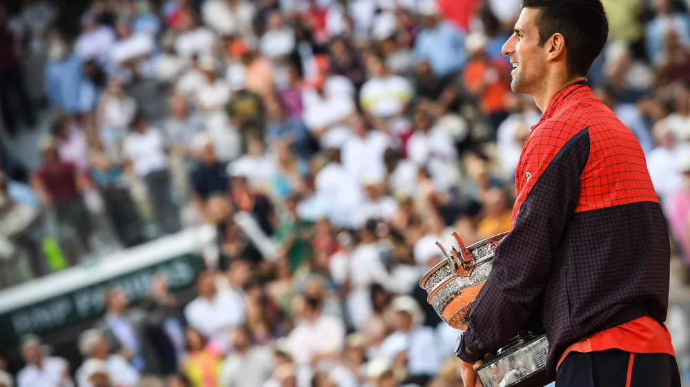FILED - 11 June 2023, France, Paris: Serbian tennis player Novak Djokovic celebrates with the trophy following his victory over Norwegian Casper Ruud during their men's singles final match of the Roland-Garros Open tennis tournament at the Court Philippe-Chatrier in Paris. Photo: Matthieu Mirville/ZUMA Press Wire/dpa