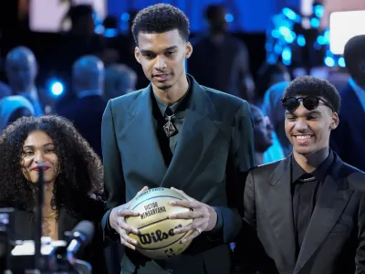 Victor Wembanyama reacts during introductions before the NBA basketball draft, Thursday, June 22, 2023, in New York. (AP Photo/John Minchillo)
