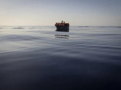 FILE - Migrants with life jackets provided by volunteers of the Ocean Viking, a migrant search and rescue ship run by NGOs SOS Mediterranee and the International Federation of Red Cross (IFCR), still sail in a wooden boat as they are being rescued, on Aug. 27, 2022. The border and coast guard agency Frontex estimated that more than 50,300 attempts were made to enter the EU without authorization from January to May. It's more than double the number in the same period last year, and the most since 2017. (AP Photo/Jeremias Gonzalez, File)