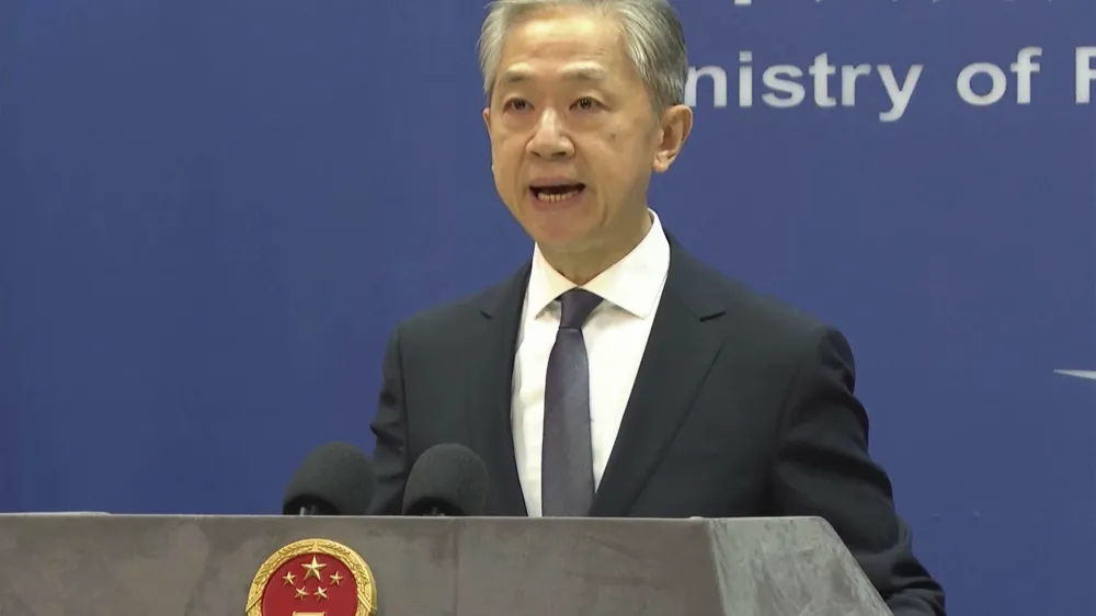 Chinese Foreign Ministry spokesperson Wang Wenbin speaks during the daily briefing in Beijing, Friday, July 14, 2023. China on Friday criticized a German government call for reducing dependency on Chinese products and reducing other potentially unstable factors in bilateral relations, calling it a form of protectionism. (AP Photo/Liu Zheng)