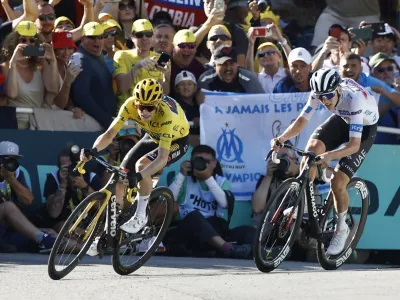 Cycling - Tour de France - Stage 15 - Les Gets Les Portes Du Soleil to Saint-Gervais Mont-Blanc - France - July 16, 2023 UAE Team Emirates' Tadej Pogacar and Team Jumbo&ndash;Visma's Jonas Vingegaard in action before crossing the finish line during stage 15 REUTERS/Stephane Mahe