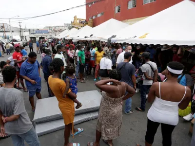 FILE PHOTO: Haitian migrants seeking refuge in the U.S., are seen outside the Casa INDI shelter as they wait to be processed by the Mexican Commission for Aid to Refugees (COMAR), in Monterrey, Mexico October 4, 2021. Picture taken October 4, 2021. REUTERS/Daniel Becerril/File Photo