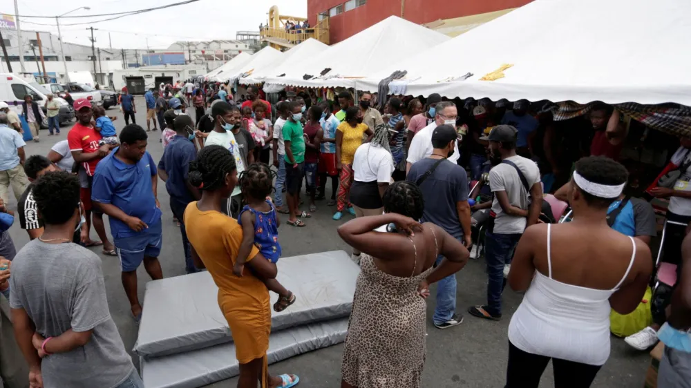 FILE PHOTO: Haitian migrants seeking refuge in the U.S., are seen outside the Casa INDI shelter as they wait to be processed by the Mexican Commission for Aid to Refugees (COMAR), in Monterrey, Mexico October 4, 2021. Picture taken October 4, 2021. REUTERS/Daniel Becerril/File Photo