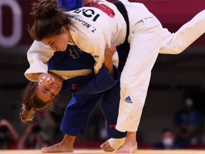 ﻿Tokyo 2020 Olympics - Judo - Women's 57kg - Repechage Round - Nippon Budokan - Tokyo, Japan - July 26, 2021. Kaja Kajzer of Slovenia scores ippon against Timna Nelson Levy of Israel REUTERS/Annegret Hilse
