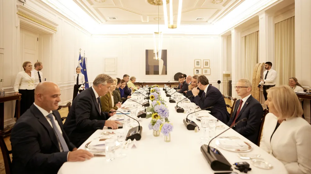 Greek Prime Minister Kyriakos Mitsotakis, European Commission President Ursula von der Leyen, President of the European Council Charles Michel, Serbian President Aleksandar Vucic, Moldovan President Maia Sandu, Ukraine's President Volodymyr Zelenskiy, Montenegro's President Jakov Milatovic, Romanian Prime Minister Marcel Ciolacu, Kosovo's Prime Minister Albin Kurti, Chairwoman of the Council of Ministers of Bosnia and Herzegovina Borjana Kristo, North Macedonia's Prime Minister Dimitar Kovacevski, Bulgarian Prime Minister Nikolai Denkov and Croatian Prime Minister Andrej Plenkovic attend a dinner at the Maximos Mansion in Athens, Greece, August 21, 2023. Dimitris Papamitsos/Greek Prime Minister's Office/Handout via REUTERS THIS IMAGE HAS BEEN PROVIDED BY A THIRD PARTY