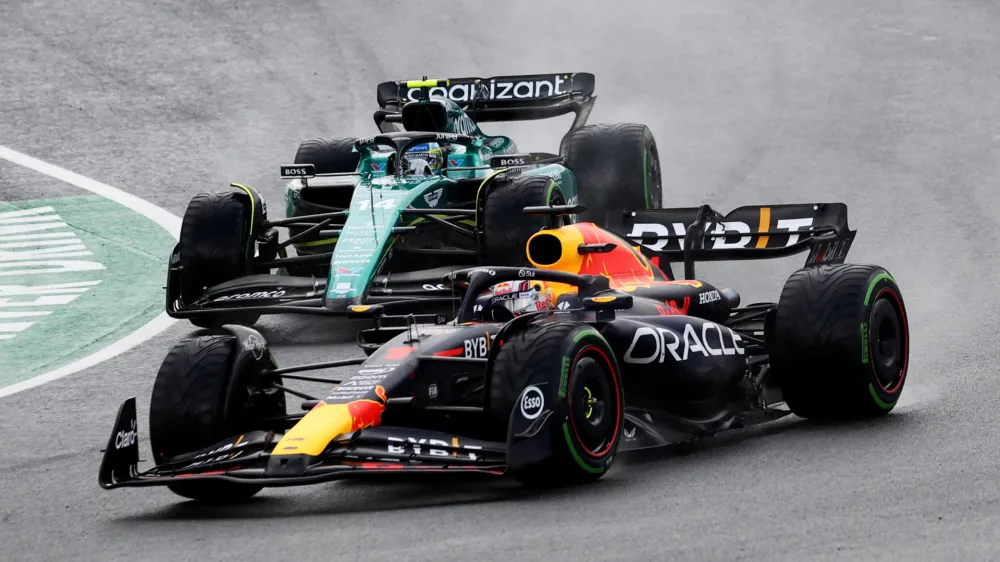 Formula One F1 - Dutch Grand Prix - Circuit Zandvoort, Zandvoort, Netherlands - August 27, 2023 Red Bull's Max Verstappen and Aston Martin's Fernando Alonso in action during the race REUTERS/Yves Herman