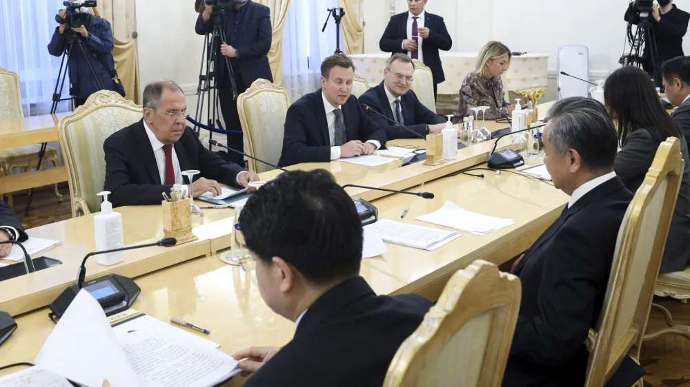 In this photo released by Russian Foreign Ministry Press Service, Russian Foreign Minister Sergey Lavrov, left, speaks with Chinese Foreign Minister Wang Yi during their talks in Moscow, Russia, Monday, Sept. 18, 2023. (Russian Foreign Ministry Press Service via AP)