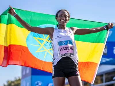 24 September 2023, Berlin: Ethiopian long-distance runner Tigst Assefa reacts after winning the BMW Berlin Marathon. Assefa betters the women's marathon world record to 2 hours 11 minutes 53 seconds in Berlin victory. Photo: Andreas Gora/dpa