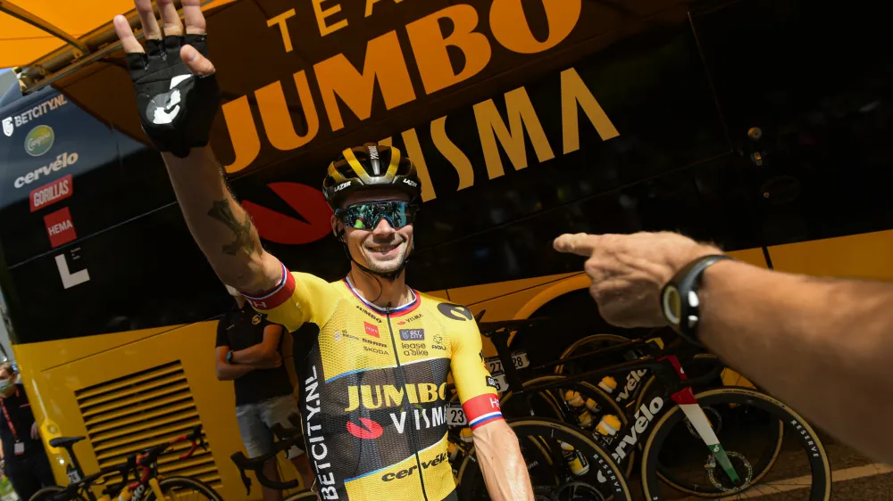 Jumbo Visma's Primoz Roglic waves fans before the start of the thirteen stage of La Vuelta between Pamplona and Lekunberri, 158,5 km (98.4 miles) in Pamplona, northern Spain, Sunday Sept. 10, 2023. (AP Photo/Alvaro Barrientos)