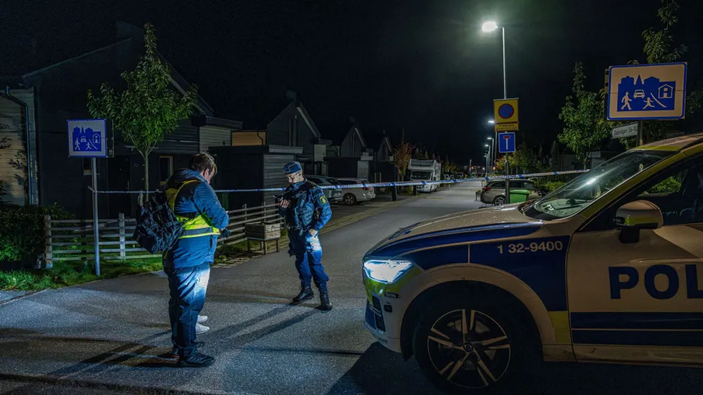 A police officer stands near police tape in Tullinge in Botkyrka, near Stockholm, Sweden, where a shooting took place, according to local media, October 13, 2023. Magnus Lejhall/TT News Agency/via REUTERS   ATTENTION EDITORS - THIS IMAGE WAS PROVIDED BY A THIRD PARTY. SWEDEN OUT. NO COMMERCIAL OR EDITORIAL SALES IN SWEDEN.