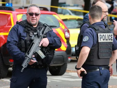 French police secure the area after a teacher was killed and several people injured in a knife attack at the Lycee Gambetta-Carnot high school in Arras, northern France, October 13, 2023. REUTERS/Pascal Rossignol