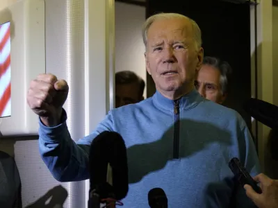 President Joe Biden talks to reporters aboard Air Force One during a refueling stop in at Ramstein Air Base in Germany, Wednesday, Oct. 18, 2023, as he travels back from Israel to Washington. (AP Photo/Evan Vucci)