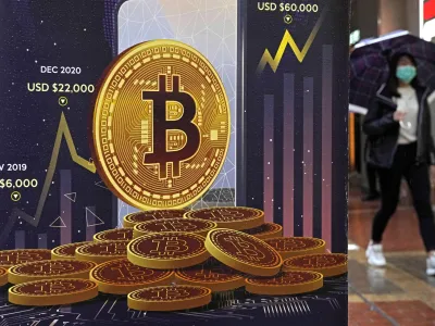 File- An advertisement for Bitcoin cryptocurrency is displayed on a street in Hong Kong, Thursday, Feb. 17, 2022. The world's largest cryptocurrency soared to almost ,000 this week, marking its highest value in nearly 18 months. (AP Photo/Kin Cheung, File)