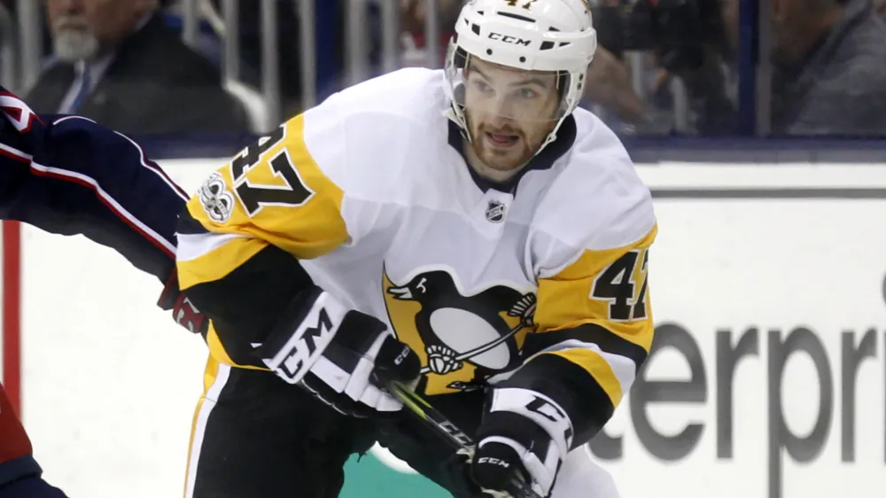 FILE - Pittsburgh Penguins forward Adam Johnson in action during an NHL hockey game in Columbus, Ohio, Friday, Sept. 22, 2017. American hockey player Adam Johnson has died after a "freak accident" during a game in England on Saturday, Oct. 28, 2023 his club said. The 29-year-old Minnesota native was playing for the Nottingham Panthers in a Challenge Cup game against the Sheffield Steelers when he suffered a slashed neck during the second period of the game at Sheffield's Utilita Arena. (AP Photo/Paul Vernon, file)
