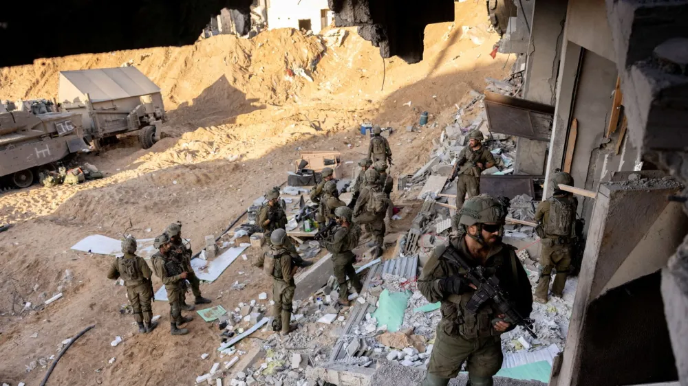 Israeli soldiers stand amid rubble, during the ongoing ground invasion against Palestinian Islamist group Hamas in the northern Gaza Strip, November 8, 2023. REUTERS/Ronen Zvulun EDITOR'S NOTE: REUTERS PHOTOGRAPHS WERE REVIEWED BY THE IDF AS PART OF THE CONDITIONS OF THE EMBED. NO PHOTOS WERE REMOVED.   TPX IMAGES OF THE DAY