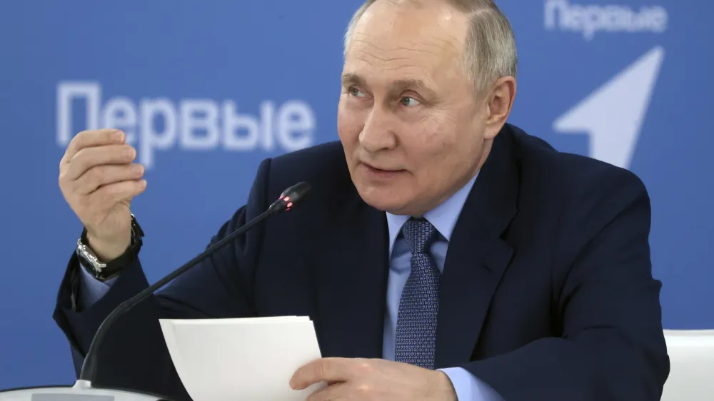 Russian President Vladimir Putin gestures while speaking at an exhibition at the Mashuk educational centre in Pyatigorsk, Stavropol region, Russia, Tuesday, Dec. 5, 2023. (Sergei Karpukhin, Sputnik, Kremlin Pool Photo via AP)