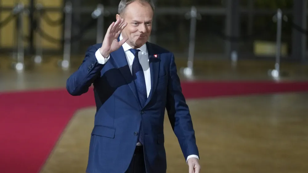 Poland's Prime Minister Donald Tusk arrives for an EU-Western Balkans summit at the European Council building in Brussels, Wednesday, Dec. 13, 2023. European Union and Western Balkans leaders meet in Brussels Wednesday to discuss political and policy engagement, economic foundations and the impact of Russian aggression against Ukraine. (AP Photo/Virginia Mayo)