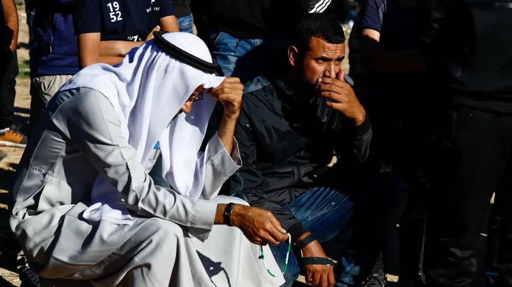 Mourners react during the funeral of Samer Fouad Al-Talalka, a member of Israel's Bedouin Arab minority who was mistakenly killed by the Israeli military while being held hostage in Gaza by the Palestinian Islamist group Hamas, in Hura village, southern Israel, December 16, 2023. REUTERS/Clodagh Kilcoyne