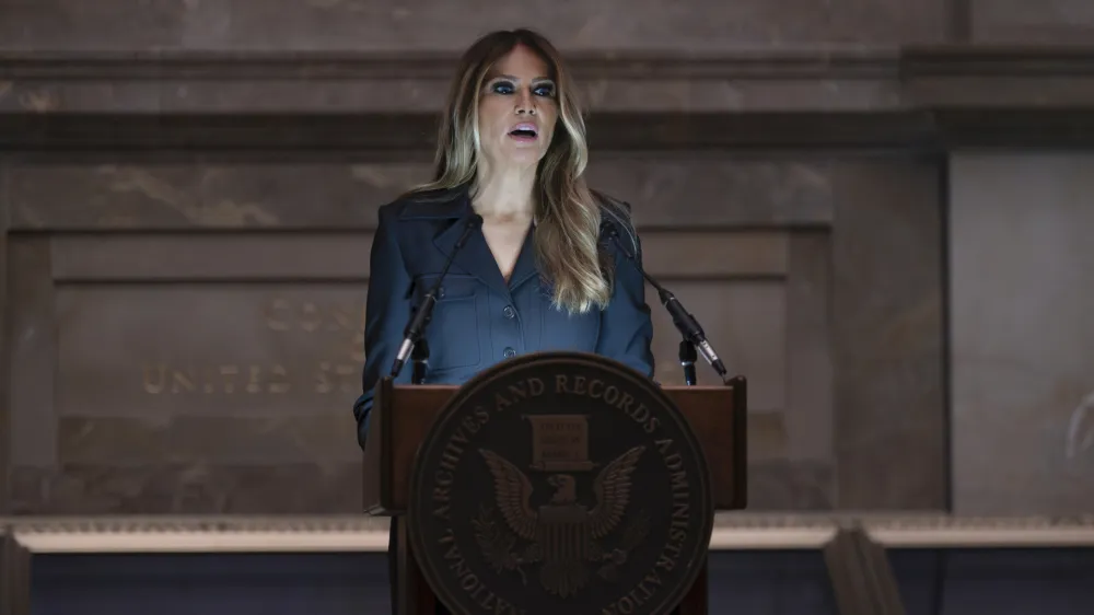 Former first lady Melania Trump welcomes newly-sworn American citizens as the National Archives holds a naturalization ceremony with 25 people from 25 nations, in Washington, Friday, Dec. 15, 2023. A naturalized citizen herself, Melania Trump, wife of former President Donald Trump, was originally from Slovenia. The event is part of the Archives' annual celebration of Bill of Rights Day. (AP Photo/J. Scott Applewhite)