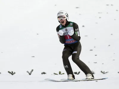 Anze Lanisek, of Slovenia, reacts after his second round jump at the second stage of the 72th Four Hills ski jumping tournament in Garmisch-Partenkirchen, Germany, Monday, Jan. 1, 2024. (AP Photo/Matthias Schrader)