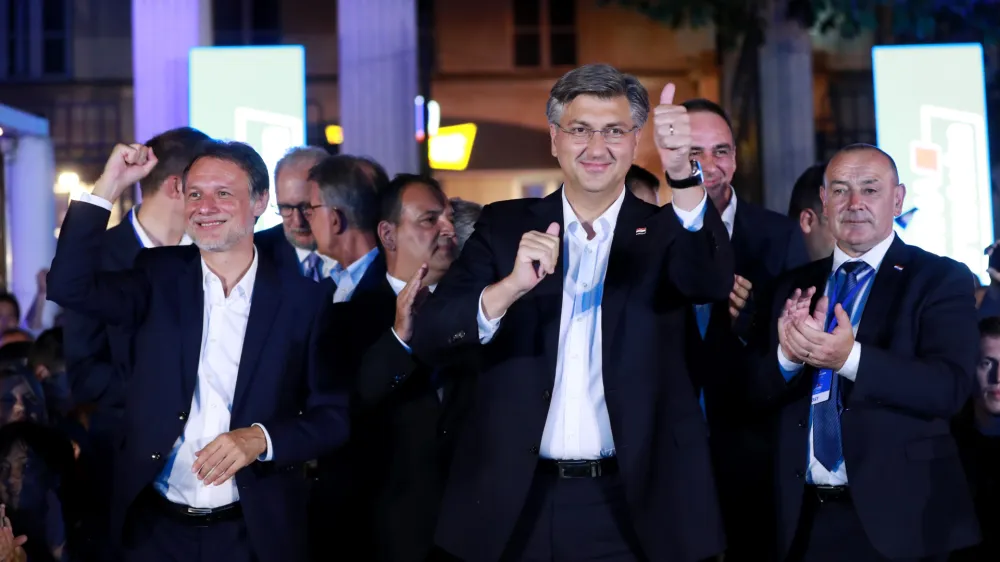 ZAGREB, CROATIA.- Croatian Prime Minister and leader of Croatian Democratic Union (HDZ) Andrej Plenkovic (C) celebrates HDZ's victory in parliamentary elections in Zagreb, Croatia, July 5, 2020. The ruling center-right HDZ, led by Prime Minister Andrej Plenkovic, won the most seats in the parliamentary elections on Sunday and was expected to form a new government soon.