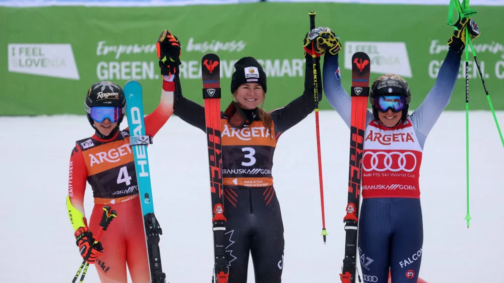 Alpine Skiing - FIS Alpine Ski World Cup - Women's Giant Slalom - Kranjska Gora, Slovenia - January 6, 2024 Canada's Valerie Grenier celebrates after winning the Women's Giant Slalom alongside second placed Switzerland's Lara Gut-Behrami and third placed Italy's Federica Brignone REUTERS/Borut Zivulovic